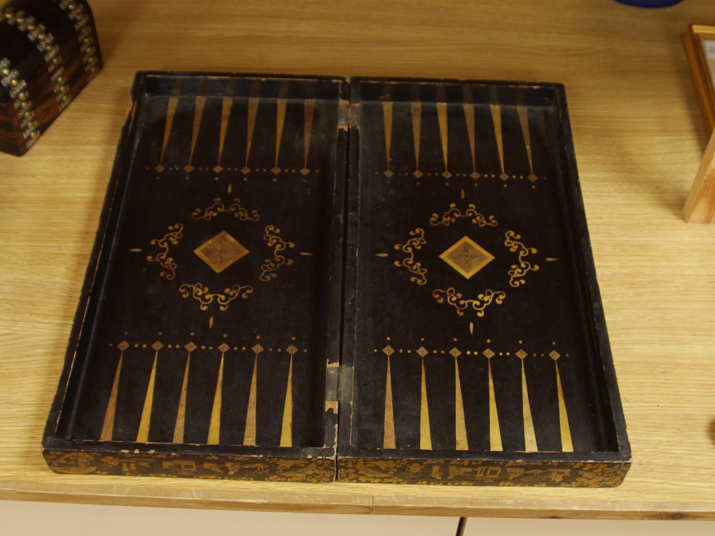 A late 19th/early 20th century Chinese lacquer chess board/box and a brass and mother of pearl mounted coromandel dome topped caddy, largest 49cm. Condition - fair